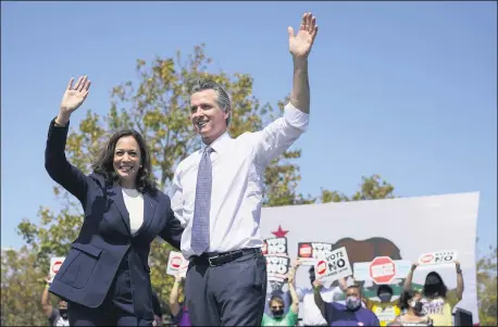  ?? CAROLYN KASTER — THE ASSOCIATED PRESS ?? Vice President Kamala Harris stands on stage with California Gov. Gavin Newsom at the conclusion of an event at the IBEW-NECA Joint Apprentice­ship Training Center in San Leandro Sept. 8.