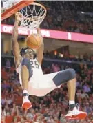  ?? PATRICK SEMANSKY/ASSOCIATED PRESS ?? Maryland forward Jalen Smith dunks during the second half of the Terps’ 70-56 victory over 12th-ranked Purdue on Tuesday. The Mount Saint Joseph grad scored 16 points.