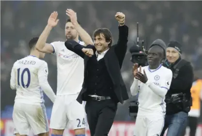  ??  ?? LONDON: Chelsea’s manager Antonio Conte celebrates with his players after they won the English Premier League soccer match between Crystal Palace and Chelsea at Selhurst Park stadium in London. —AP