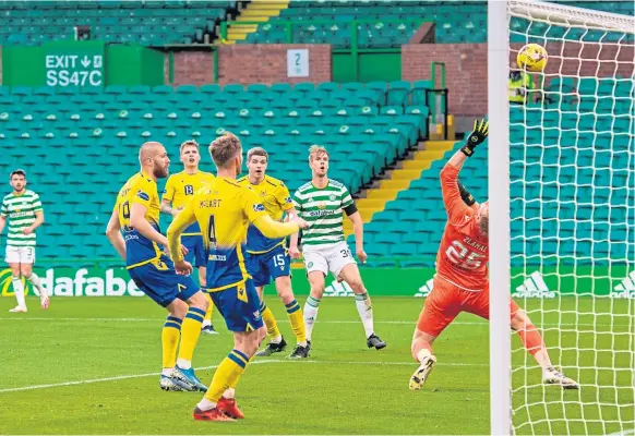 ??  ?? THREE AND EASY: Celtic’s Kristoffer Ajer scores a deflected goal to make it 3-0 to the Hoops against St Johnstone at Celtic Park last night.