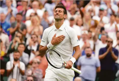  ?? Kirsty Wiggleswor­th / Associated Press ?? Novak Djokovic had unexpected trouble in Wimbledon’s first round, needing four sets to beat unseeded Kwon Soon-woo.