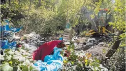  ?? JULIE JOCSAK TORSTAR ?? The largest of possibly dozens of homeless camps throughout Niagara was cleaned up Monday, with about 20 truckloads of debris hauled away.