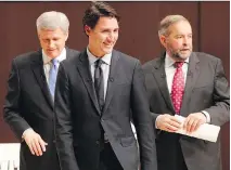  ?? F R E D T H O R N H I L L / T H E C A NA D I A N P R E S S F I L E S ?? From left, Conservati­ve Leader Stephen Harper, Liberal Leader Justin Trudeau and NDP Leader Tom Mulcair after the Munk Debate on Canada’s foreign policy last month.