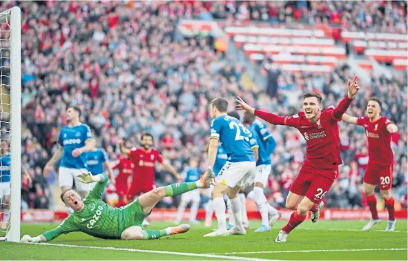  ?? ?? Andy Robertson shows his delight after putting the ball past Everton keeper Jordan Pickford to give Liverpool the lead in the Merseyside derby