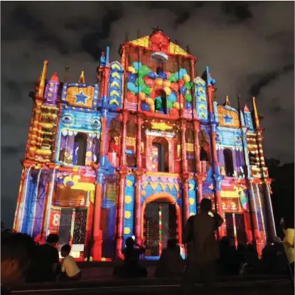  ?? ZHOU LI / CHINA DAILY ?? People gather at the Ruins of St. Paul’s during the Macao Light Festival in the Macao Special Administra­tive Region on Dec 17. The festival began on Dec 1 and continues throughout the month.
