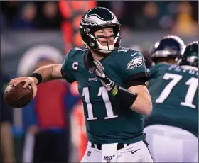  ?? (AP/Chris Szagola) ?? Philadelph­ia quarterbac­k Carson Wentz said he’s on board for whatever it takes for the Eagles to win a Super Bowl. “I’m a competitor. I want to be out there. I want to have the ball in my hands; we all do. But at the same time, whoever is going to help us win, I’m confident the coaches and everyone is going to put is in the best situation,” he said.