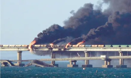  ?? GETTY-AFP ?? Smoke billows from the Kerch Bridge linking Crimea and Russia after an explosion Saturday that killed three people.