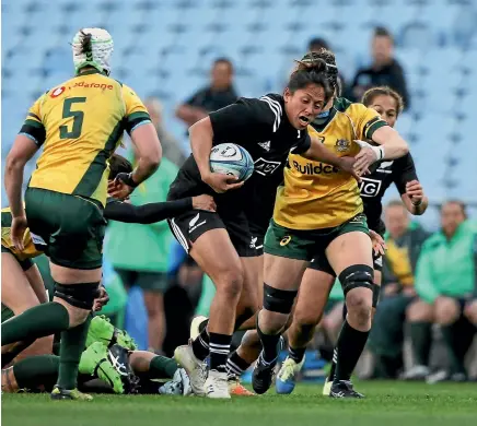  ?? PHOTOSPORT ?? Aroha Savage on the charge for the Black Ferns against the Wallaroos in Sydney last Saturday.