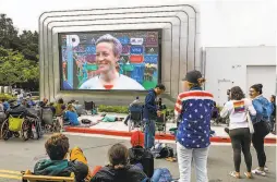  ??  ?? Fans watch player Megan Rapinoe after the U.S. team defeated Netherland­s 20. Many support Rapinoe’s and the team’s quest for pay equity.