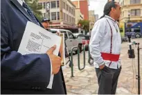  ?? William Luther / Staff file photo ?? Attorney Art Martinez de Vara holds a copy of the lawsuit he filed on behalf of the Tap Pilam Coahuiltec­an Nation.