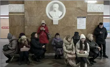  ?? EMILE DUCKE — THE NEW YORK TIMES ?? Civilians shelter in a subway station as an air raid alarm sounds in Kyiv, Ukraine, on Friday. Russia targeted Ukraine's already battered infrastruc­ture with drones, rockets and cruise missiles on Friday.