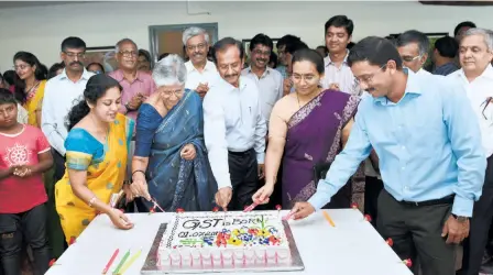  ??  ?? OFFICIALS OF THE CENTRAL EXCISE and Commercial Tax department­s and representa­tives of trade and industry at the launch of GST in Coimbatore on July 1, 2017.