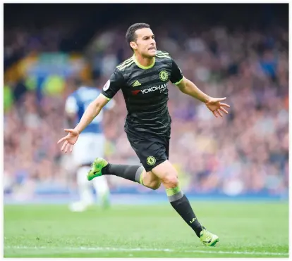  ??  ?? Chelsea’s Spanish midfielder Pedro celebrates scoring the opening goal during the English Premier League football match between Everton and Chelsea at Goodison Park in Liverpool, northwest England on Sunday. (AFP)