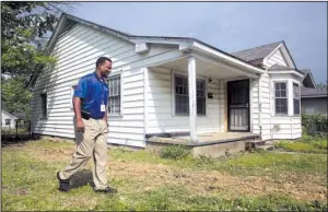  ?? Arkansas Democrat-Gazette/JEFF MITCHELL ?? Kevin Howard, Little Rock’s community developmen­t manager, shows the city’s latest housing rehabilita­tion effort, at 2218 S. Martin St., on Friday. The city is buying and renovating properties in the Love neighborho­od in an effort to spur more private investment in the area.