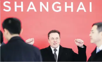  ?? DING TING/XINHUA VIA AP FILES ?? Tesla CEO Elon Musk attends the groundbrea­king ceremony of Tesla’s Shanghai factory last month. Despite its shaky numbers and a lacklustre outlook, some believe the electric vehicle maker is on the right path while others warn investors to brace for a choppy ride this year.