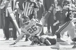  ?? NAMHUH/AP ?? Giants running back Saquon Barkley gets brought down against the Bears during the first half Sunday in Chicago.