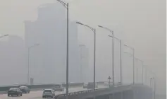  ??  ?? File photo shows vehicles move amid heavy smog on a polluted day in Beijing, China. — Reuters photo