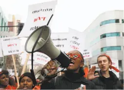  ??  ?? Carlita Landrum of Oakland Tech rallies with her classmates as they march to call attention to their teachers who are threatenin­g to strike.