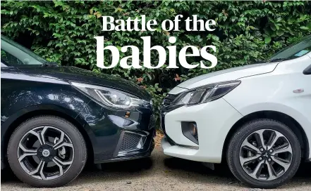  ?? DAMIEN O’CARROLL/ STUFF ?? How does the Mitsubishi Mirage, in white, stack up against the MG3?