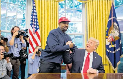  ??  ?? Kanye West told Donald Trump that his Make America Great Again cap “gives me power”, although he did suggest dropping the Again.