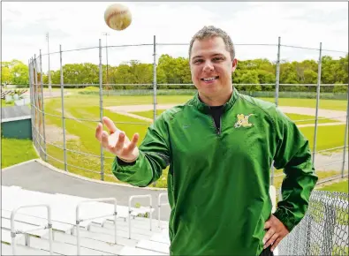  ?? SEAN D. ELLIOT/THE DAY ?? New London High School baseball coach Matt Greene poses at Sal Amanti Field in New London on Monday.