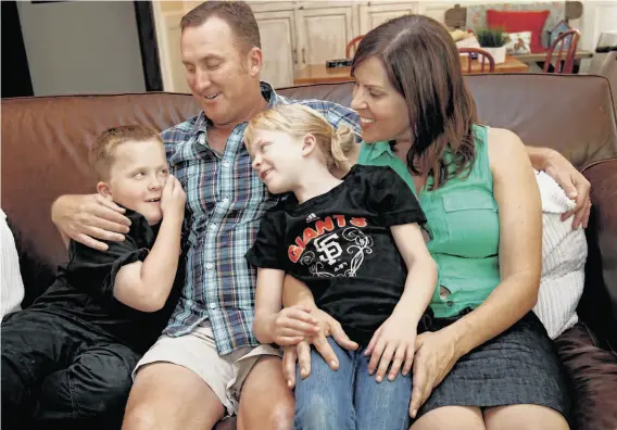  ?? Photos by Brant Ward / The Chronicle ?? Kevin and Teresa Partington have seen tremendous improvemen­t in twins Patrick and Jenna since they began taking the new drug for cystinosis.