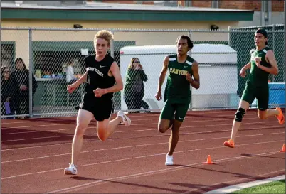  ?? Haley Sawyer/The Signal (See additional photos on signalscv.com) ?? Golden Valley’s Daniel Rush rounds the corner as Canyon’s Ethan Danforth (middle) and Patrick King (right) trail him in a Foothill League meet at Canyon on Thursday. The Cowboys won the meet 71-65.