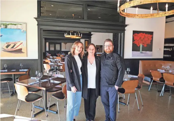  ?? Alex, Sheree and Jeffrey Holloway stand inside Sparrow Modern Italian on Feb. 8. The Holloways, owners of Cafe 501, Boulevard Steakhouse and Sparrow, have been building upon their legacy for three decades. DOUG HOKE/THE OKLAHOMAN ??