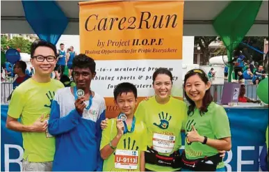  ??  ?? Care2Run children proudly showing their first ever medals.