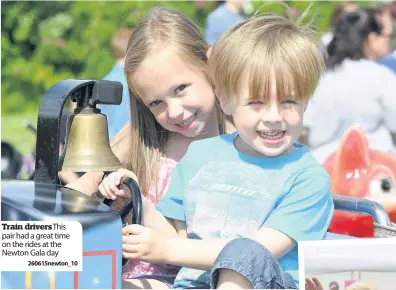  ??  ?? Train drivers This pair had a great time on the rides at the Newton Gala day