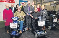  ?? Picture: Fraser Band. ?? Dave McLellan, seated right, received an engraved award for his work.