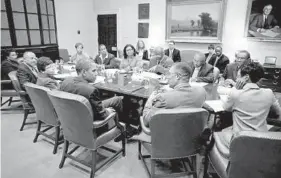  ?? CHUCK KENNEDY/WHITE HOUSE PHOTO ?? DeWayne Wickham and members of the Trotter Group meet with President Obama in the Roosevelt Room of the White House in 2010.