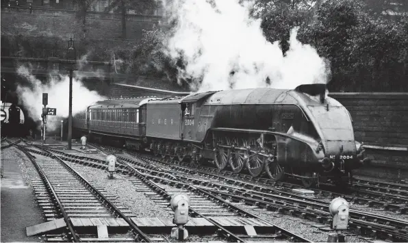  ?? ?? Below: What a mighty impression of grace and power P2 Mikado No. 2004 Mons Meg, built in this form from new, portrays as it leaves The Mound tunnel and enters Edinburgh Waverley with the 9am from Aberdeen on July 11, 1938. JOHN P. WILSON/RAIL ARCHIVE STEPHENSON