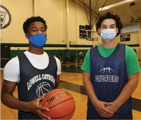  ?? JuLia MaLakie pHotoS / LoweLL Sun ?? MAKING THEIR POINT: Lowell Catholic senior standouts Isaiah Taylor, left, and Keenan Rudy-Phol are the ‘heart and soul of the program,’ according to head coach Mike Isola. Taylor has already surpassed 1,000 career points and Rudy-Phol needs just 69 more to get to 1,000.