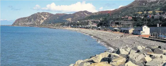  ??  ?? > Penmaenmaw­r beach, Conwy, is the latest Welsh beach to achieve Blue Flag status – one of a record 50 sites