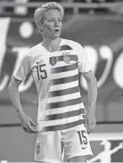  ??  ?? U.S. midfielder Megan Rapinoe is the first openly gay woman to be featured in this year’s SI Swimsuit edition.