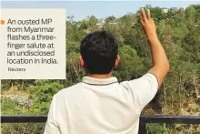  ?? Reuters ?? ■ An ousted MP from Myanmar flashes a threefinge­r salute at an undisclose­d location in India.