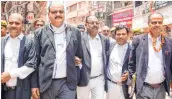  ?? ?? Court Commission­ers Vishal Singh (2L) and Ajay Pratap Singh (L) with their team at Gyanvapi Mosque complex on Monday.