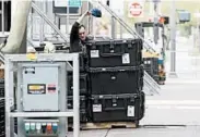  ?? ROSS D. FRANKLIN/AP ?? A worker packs up a stage at the Phoenix venue where Sunday’s Democratic debate was first set to take place.