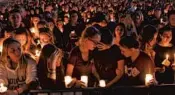  ?? JIM RASSOL/SUN SENTINEL ?? A vigil was held Feb. 15 for the victims of the mass shooting at Marjory Stoneman Douglas High School at the Udine Amphitheat­re located inside Pines Trail Park.