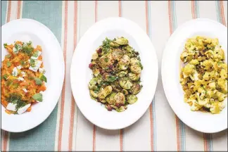  ??  ?? From left: Smashed carrots with feta and mint, Brussels sprouts with smoky chorizo and sweet-and-sour caulif lower with golden raisin. These three side dishes would be perfect additions to any Thanksgivi­ng table.