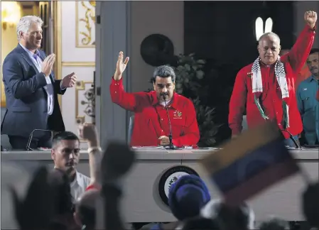  ?? FILE PHOTO: ARIANA CUBILLOS — THE ASSOCIATED PRESS ?? Cuba’s President Miguel Diaz-Canel, left, Venezuela’s President Nicolas Maduro, center, and Venezuelan Socialist Party President Diosdado Cabello, right, attend the closing ceremony of the Sao Paulo Forum at Miraflores presidenti­al palace in Caracas, Venezuela, Sunday, July 28, 2019.