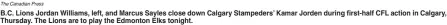  ?? The Canadian Press ?? B.C. Lions Jordan Williams, left, and Marcus Sayles close down Calgary Stampeders’ Kamar Jorden during first-half CFL action in Calgary, Thursday. The Lions are to play the Edmonton Elks tonight.