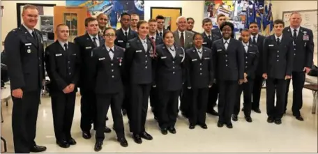  ?? SUBMITTED PHOTO – COATESVILL­E AREA INTERMEDIA­TE HIGH SCHOOL ?? Air Force Junior ROTC cadets gather for a photo with Col. Ben Young after he inspected the unit and gave them a rating of “Exceeding Standards.”