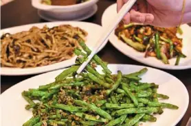  ?? ?? stir-fried French beans (in the foreground).