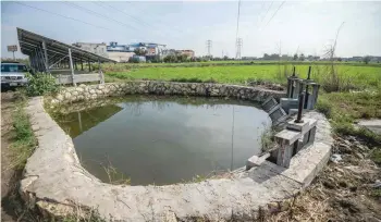  ?? — AFP ?? A picture shows a water basin used for field watering in Kafr al Dawar village in northern Egypt’s Nile Delta.