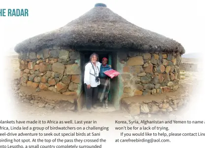  ??  ?? While in South Africa on a birding tour, Linda made a detour into Lesotho where she gave a blanket to a grandmothe­r in a small villiage there.