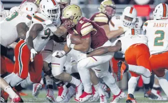  ?? ASSOCIATED PRESS ?? RIDING OUT THE STORM: After escaping Miami last weekend at Alumni Stadium, AJ Dillon and Boston College take on Virginia Tech tomorrow in Blacksburg, Va.