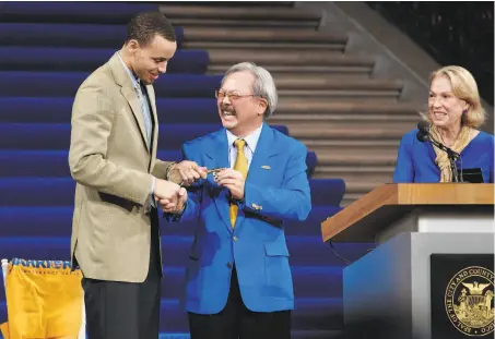  ?? Michael Macor / The Chronicle 2013 ?? San Francisco Mayor Ed Lee presented Warriors guard Stephen Curry with a key to the city after the 2013 NBA playoffs.