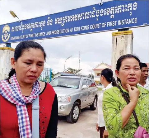  ?? LICADHO ?? Duong Saktheary (left) and Ty Mary, mothers of two Mother Nature activists, stand outside the Koh Kong Provincial Court, where their sons were tried yesterday.